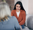 Sad woman, therapist and crying in consultation for addiction, mental health or support counseling. Female patient and counselor or shrink helping solve issue in healthcare, therapy session or advice