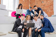 © andrey - a group of men and women in coworking. the concept of teamwork.