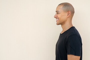 Profile view portrait of handsome bald man wearing t-shirt