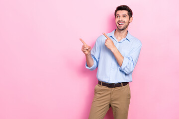 Wall Mural - Photo of cheerful nice man boss director economist two arm direct empty space presenting novelty isolated on pink color background