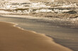 Ocean waves on a sandy beach