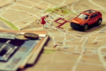 Wall Mural - travel concept - small toy car on the map