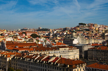 Wall Mural - Awesome aerial landscape view of city center of Lisbon. View from top of Santa Justa Lift. Vintage buildings with red tile roofs. Travel and tourism concept. Sunny day