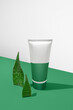 mockup of beauty fashion cosmetic makeup bottle lotion with aloe vera plant ,skincare healthcare concept,