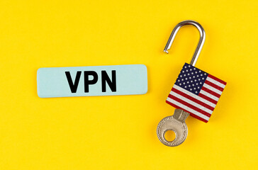 Poster - On the yellow surface is an open lock with a key and a sticker with the inscription - VPN
