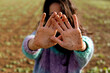 © Sheila - Unrecognizable woman showing dirty land hands to camera. Earth care and protection
