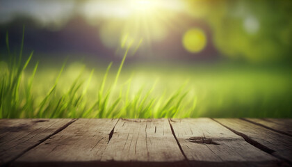 Beautiful spring natural background with green fresh juicy young grass and empty wooden planks in nature morning outdoor. Beauty bokeh and sunlight