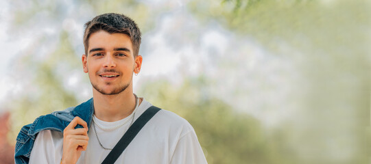 Canvas Print - smiling portrait of young man outdoors