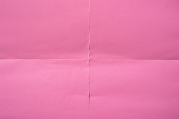 Wall Mural - Pink paper background with creases that separates paper into four parts