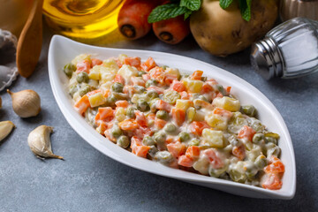 Russian salad Olivier with mayonnaise and egg served (Turkish name; Rus salatasi)