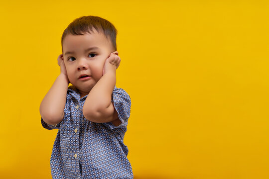Stop bullying. Scared toddler Asian kid boy wearing