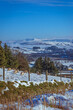 Farmland and mountains in the Brecon Beacons, Wales during winter.