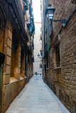 Fototapeta Uliczki - Narrow street in the Gothic quarter (Barri Gotic) in Barcelona, Catalonia, Spain, Europe