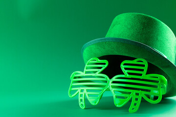 Sticker - Image of green hat, green clover glasses and copy space on green background