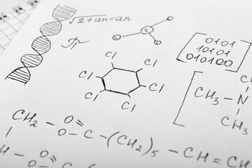 Wall Mural - Sheet of paper with different chemical formulas, closeup