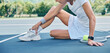 © Delcio/peopleimages.com - Tennis, woman and ankle pain on court, fitness and sunshine for training, muscle strain and broken. Female athlete, player and lady with foot injury, inflammation and bruised bone outdoor or tension