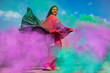 © IndiaPix - woman playing with colors on the occasion of holi