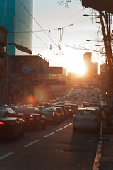 Poster - Evening rush hour cityscape photo. Cars on roadway. Beautiful urban scenery photography with blurred background. Street scene. High quality picture for wallpaper, travel blog, magazine, article