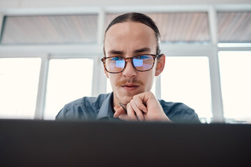 Poster - Internet, laptop and serious businessman in office for email, typing and creative, web design and idea Website, search and seo man with glasses on online project, task and problem solving in London