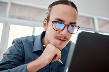 Poster - Serious man, internet and laptop in office for email, typing and creative, design and idea in business. Website, search and seo guy with glasses busy on online project, task and problem solving in IT