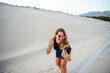 © Cavan Images - Young woman with mobile cell phone is excited and joy
