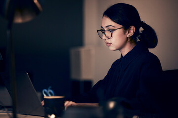 Poster - Woman, night office and laptop for business, coding and strategy in dark startup company. Female working overtime online with technology on website, computer programmer and search internet analytics