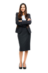 A gorgeous young indian business excutive or and entrepreneur looking confident with her hands crossed and in a business suit isolated on a png background.