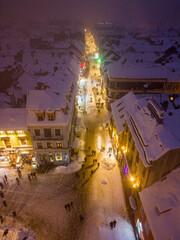 Wall Mural - Aerial drone view of Brasov town in winter at night, Romania.