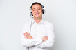 © luismolinero - Telemarketer Brazilian man working with a headset isolated on white background keeping the arms crossed in frontal position