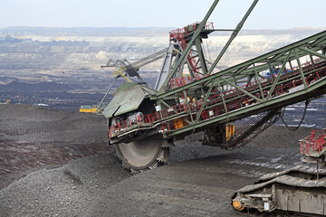 Wall Mural - Bucket-wheel excavator during excavation at the surface mine. Huge excavator on open pit mine.