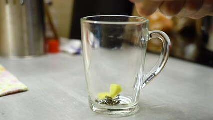 Sticker - Ginger is cut into pieces and dropped into a glass to make green tea. 