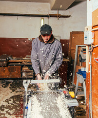 Wall Mural - Work on woodworking machines and saws in a furniture workshop