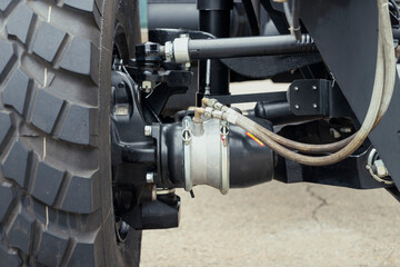 Poster - Underneath View of a Semi Truck or Trailer Rear Axle with the Suspension, Brake Cylinder Pod pneumatic system Close up View. Mud truck chassis frame suspension with wheel and arms with silent blocks