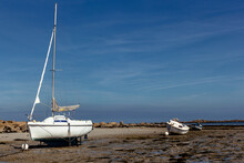 Beach Of Brignogan-Plages At Low Tide With Many Sailboats On Ground, Brittany, France