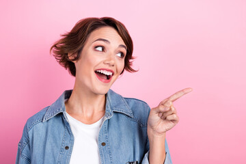 Sticker - Portrait photo of young positive surprised girl wearing denim shirt shirt looking interested new product promotion isolated on pink color background