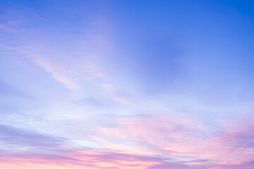 Wall Mural - Sky with soft and fluffy pastel pink and blue colored clouds. Sunset background. Nature. sunrise. Instagram toned style
