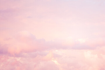 Wall Mural - Sky with soft and fluffy pastel pink and blue colored clouds. Sunset background. Nature. sunrise. Instagram toned style