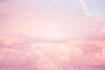 Wall Mural - Sky with soft and fluffy pastel pink and blue colored clouds. Sunset background. Nature. sunrise. Instagram toned style