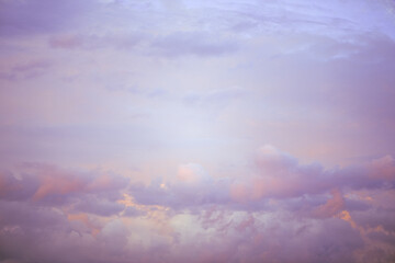 Wall Mural - Sky with soft and fluffy pastel pink and blue colored clouds. Sunset background. Nature. sunrise. Instagram toned style
