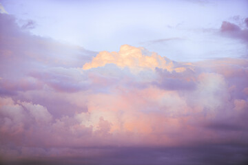 Wall Mural - Sky with soft and fluffy pastel pink and blue colored clouds. Sunset background. Nature. sunrise. Instagram toned style