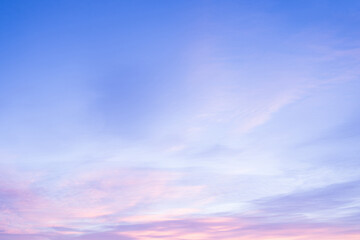 Wall Mural - Sky with soft and fluffy pastel pink and blue colored clouds. Sunset background. Nature. sunrise. Instagram toned style