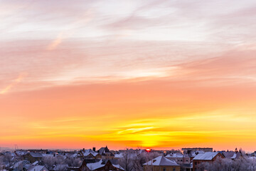 Wall Mural - Sky with soft and fluffy pastel orange pink and blue colored clouds. Sunset background. Nature. sunrise. Instagram toned style