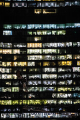 Canvas Print - urban background with of illuminated offices in glass skyscraper in Moscow city business district in evening