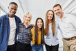 © baranq - Portrait of multiracial group of people standing together in office