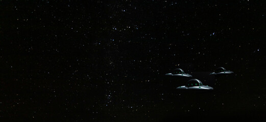 Wall Mural - Trio of UFOs with copy space to the left