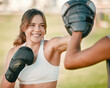 © Delcio/peopleimages.com - Woman, personal trainer and boxing exercise outdoor in nature park for fitness, health and wellness. Couple of friends happy about sports workout or mma training with motivation, energy and coaching
