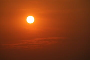 Wall Mural - sunrise back over red sky with clear orange cloud in the morning