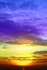 Wall Mural - sunset colorful red orange purple cloud on light and dark orange sky