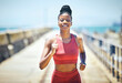 © Siyavuya P/peopleimages.com - Black woman, fitness and running with smile for exercise, cardio workout or training in the outdoors. Happy African American female runner smiling in run, exercising or marathon for healthy lifestyle