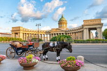Russia, St. Petersburg, A Carriage In Front Of The Kazan Cathedral, A Tourist Attraction On Nevsky Prospekt At Sunset In The Summer Evening